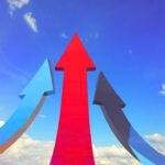 Three upward arrows, symbolizing strategies to quickly boost your credit card limit and improve financial standing