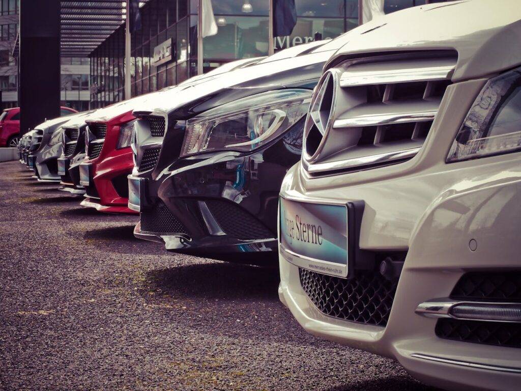 Row of used cars at a dealership, representing the UK used car market from 2010 to 2024