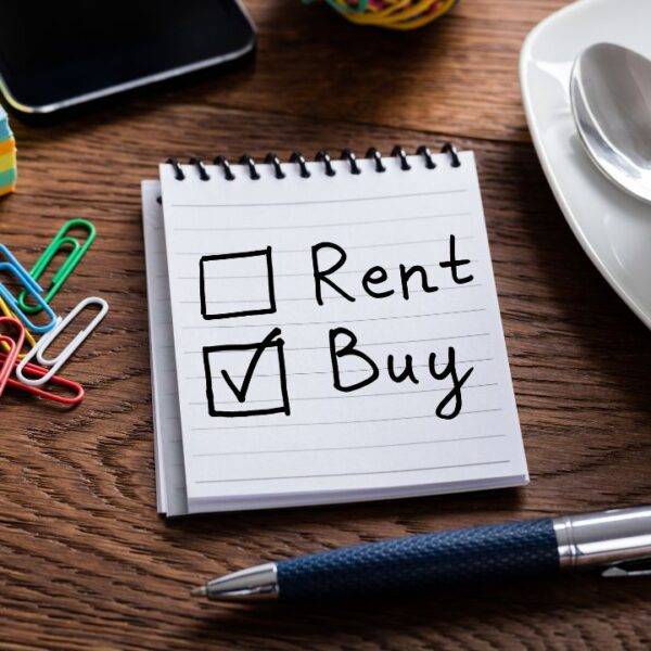 A notepad with 'Rent' and 'Buy' options, with 'Buy' checked, symbolizing the decision-making process for first-time buyers exploring low-doc mortgages in the UK