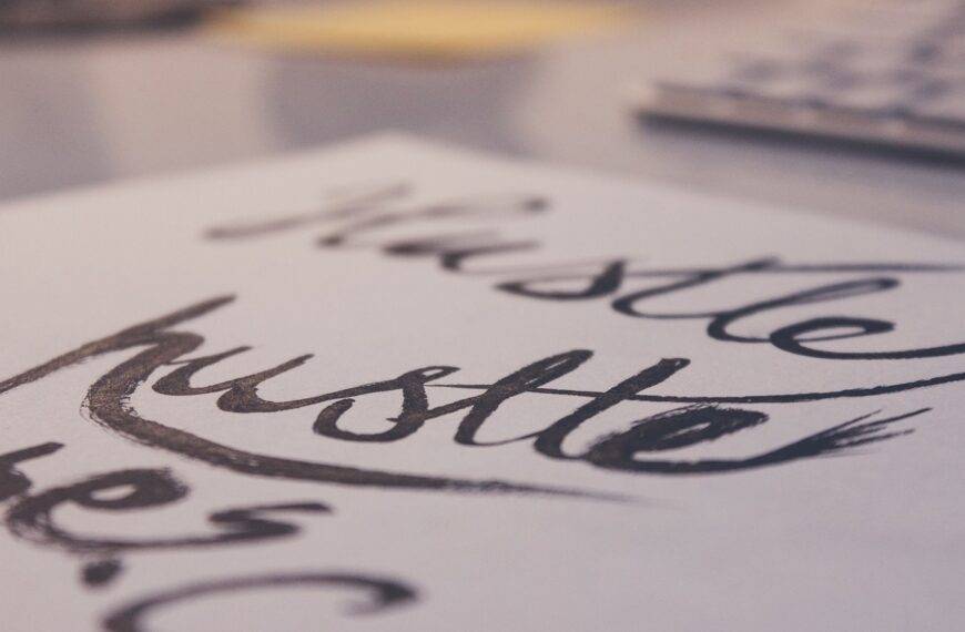 Close-up of the word "hustle" written in cursive, representing the comparison between side hustles and part-time jobs