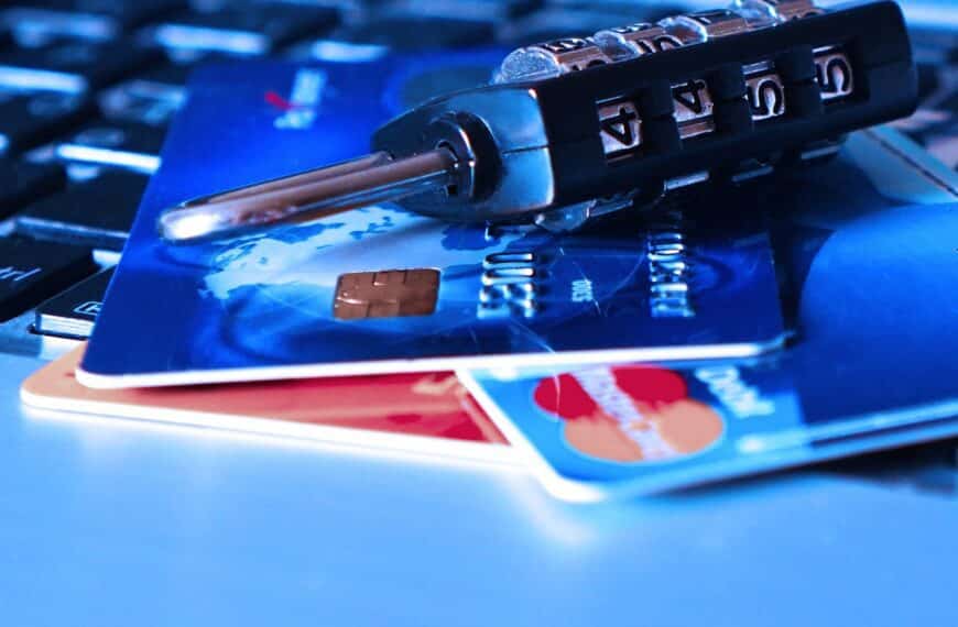 Close-up of credit cards with a combination lock, symbolizing security and the acceptance challenges of American Express in UK stores