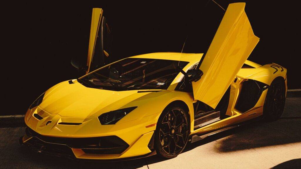 A yellow sports car with doors open, symbolizing car loans and financing options.