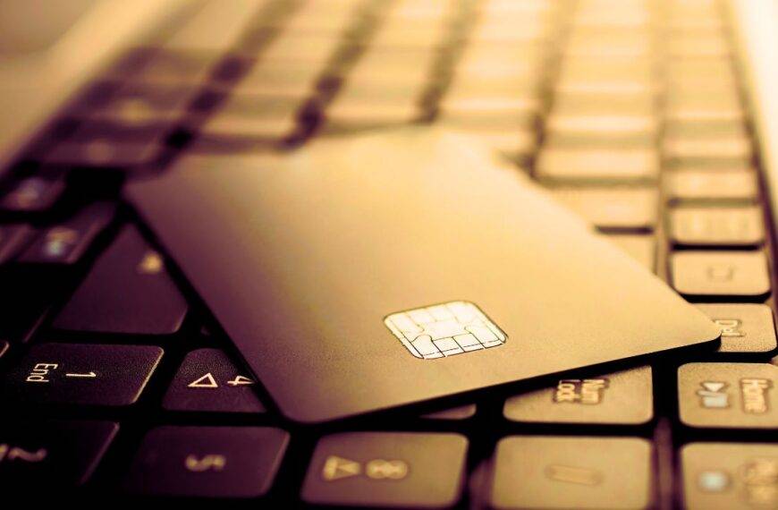 Close-up of a credit card on a laptop keyboard symbolizing online business transactions with a business credit card.