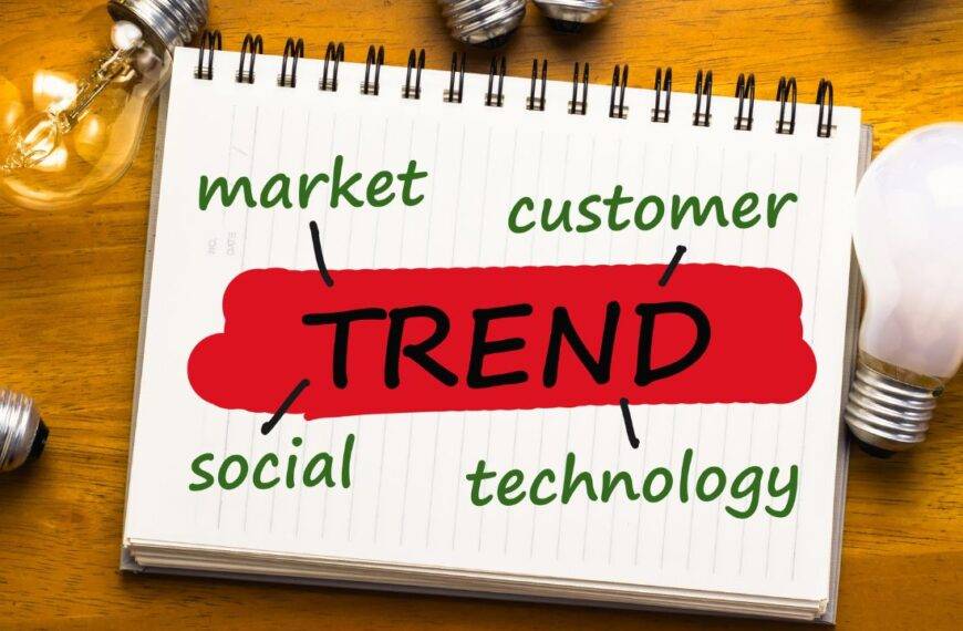 A notepad with the word "Trend" and key factors like market, customer, social, and technology, representing job trends for 2030