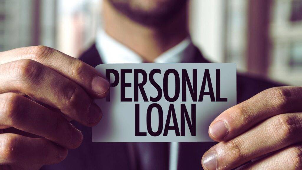 A man holding a card with the words "Personal Loan," illustrating steps to pre-qualify for personal loans