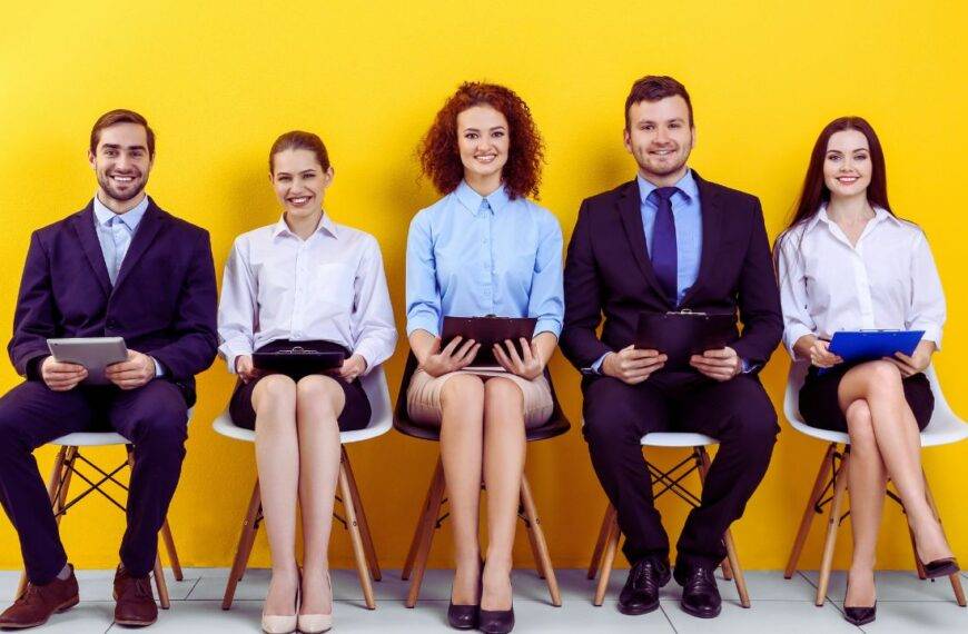 A group of diverse candidates seated, waiting for interviews, representing the future of job hiring in 2030