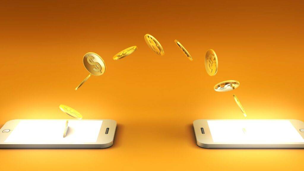 Illustration of coins transferring between two mobile phones, symbolizing digital banking and mobile money transfers