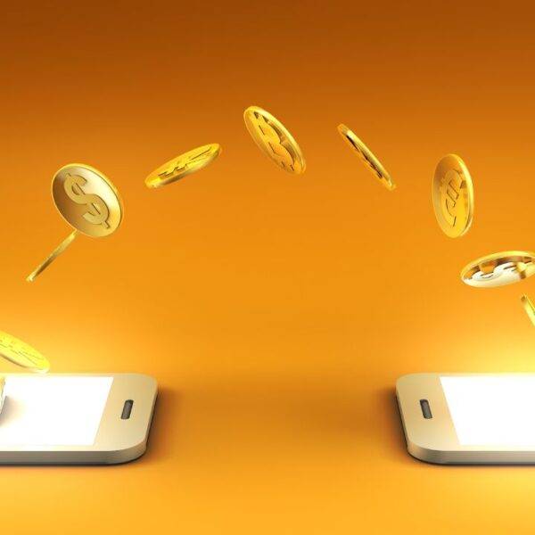 Illustration of coins transferring between two mobile phones, symbolizing digital banking and mobile money transfers