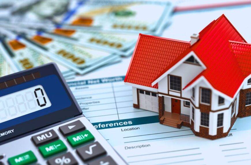 A small house model, calculator, and financial documents representing self-employed mortgage requirements.