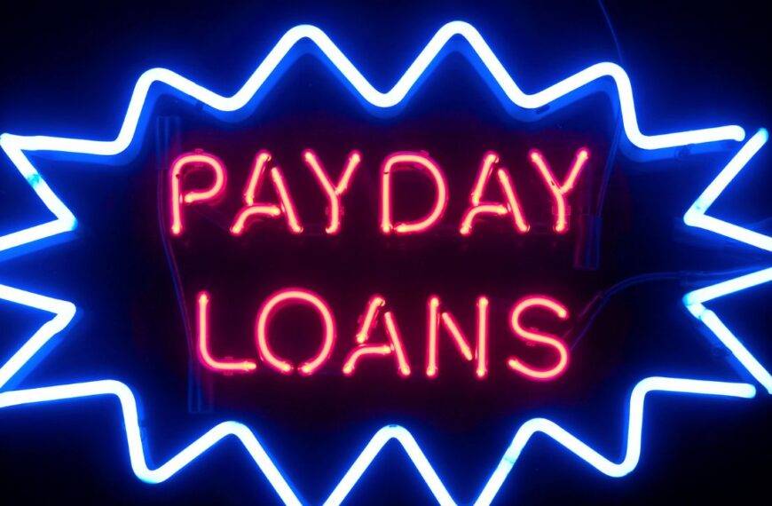 Neon sign displaying "Payday Loans," representing the concept of short-term, high-interest loans.