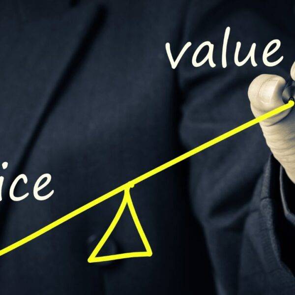 A chart comparing price and value with a balancing scale, representing rising car insurance rates in the UK